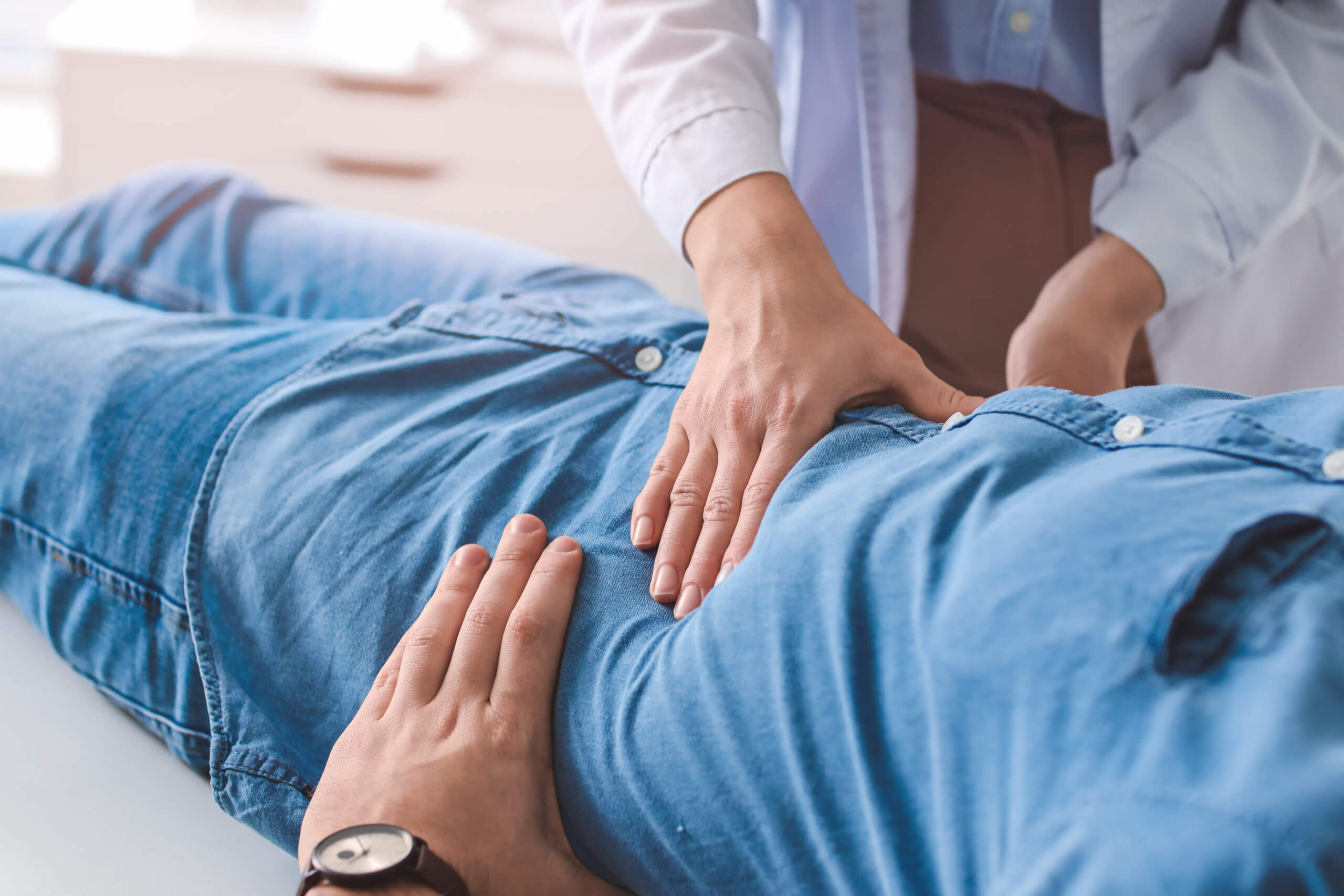 A patient receiving an abdominal exam at a digestive healthcare center in Tucson