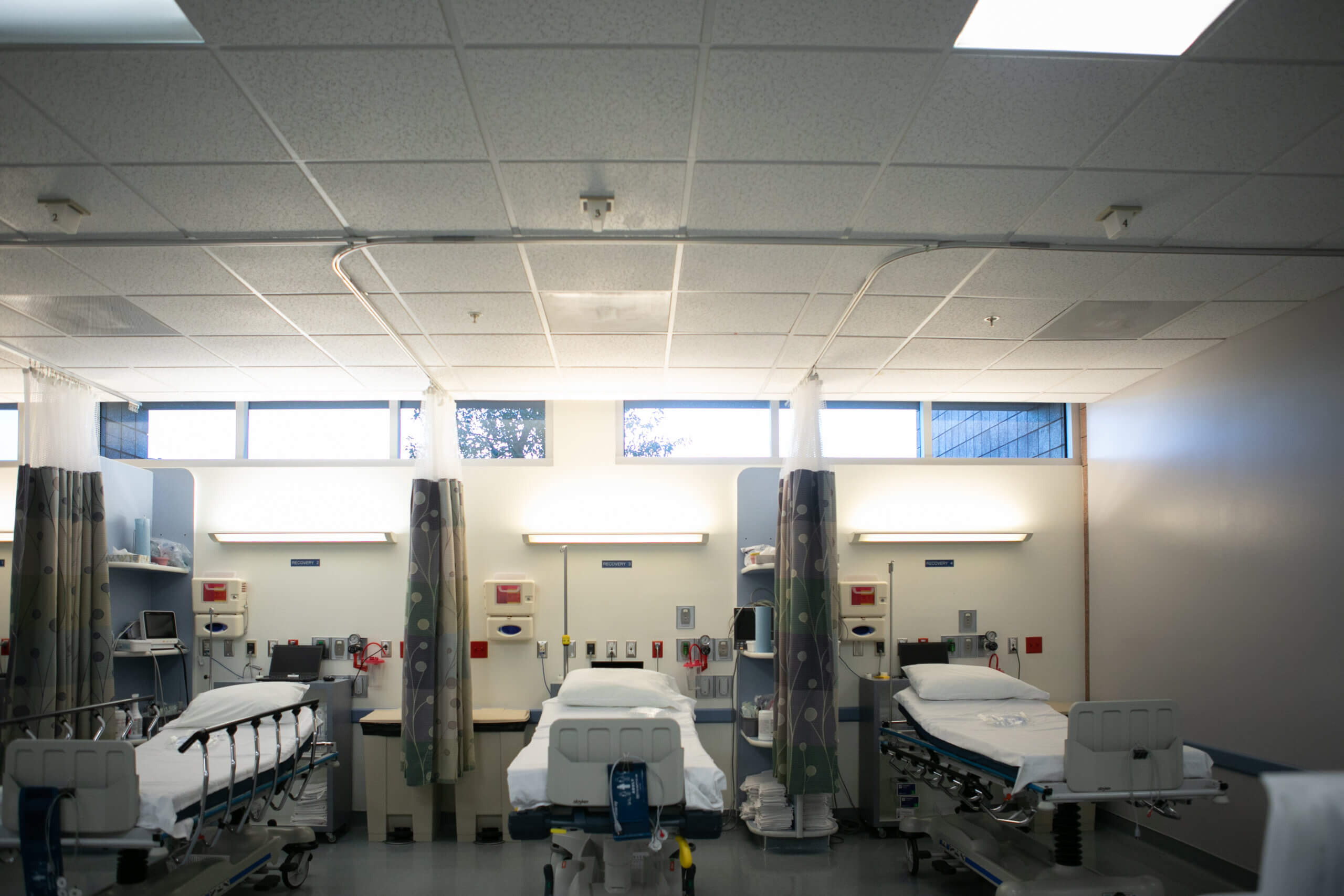 A row of three hospital beds where gastrointestinal doctors examine patients